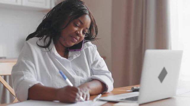 Multitask and remote work from home, portrait of black woman talking by mobile and making notes, online job and consultation with specialists by phone, tech support and customer service, out of office