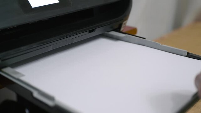 Filling a printer with a stack of paper. Office and home printer