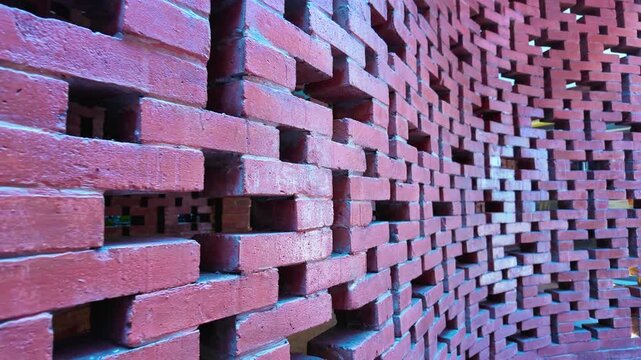 Aesthetic Curved Red Brick Wall with Geometric Hollow Patterns