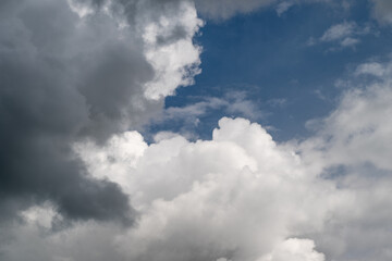 Fototapeta premium View of clouds from high altitude. Aerial perspective of layered cloud formations and horizon. Capturing scenic view of multiple cloud layers from aircraft window at altitude