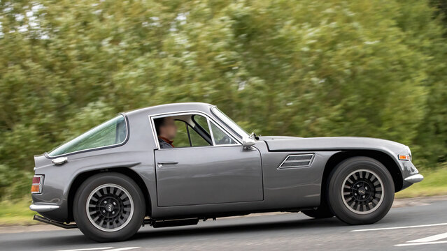 Stony Stratford,Bucks,UK - June 7th 2026:  1971 TVR Vixen classic car driving on a British road