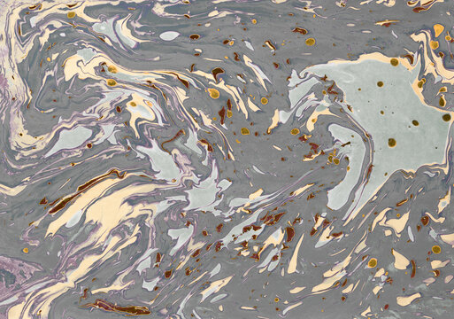 Abstract grey and cream marble background with mustard yellow splatters.