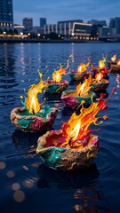 Obraz premium Floating oil lamps with paint splashes on river water near city skyline at dusk