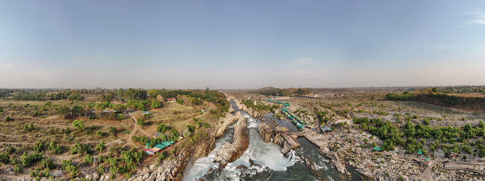 Panoramic drone view of Dhuandhar Waterfall and marble rock canyon on the Narmada River in Jabalpur, India.