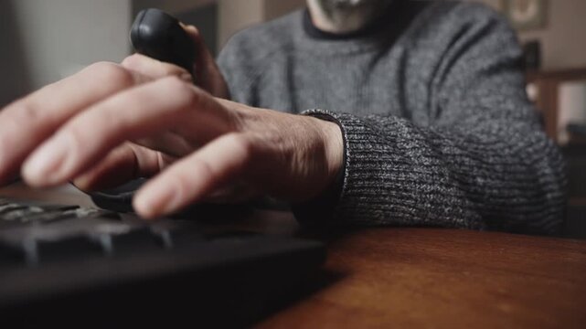 Close-up of a user operating a joystick while interacting with a keyboard, suggesting game development, software testing, esports, and interactive technology.