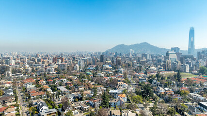 Naklejka premium Santiago, Chile. Aerial view with the Andes mountain range in the background. Mountain range and snow-capped mountains.
