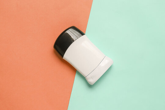 Antiperspirant tube on pink blue background. Sweat protection. Top view
