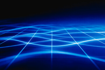 Obraz premium Abstract glowing blue light grid forming a dynamic digital network, representing modern technology and data connectivity.