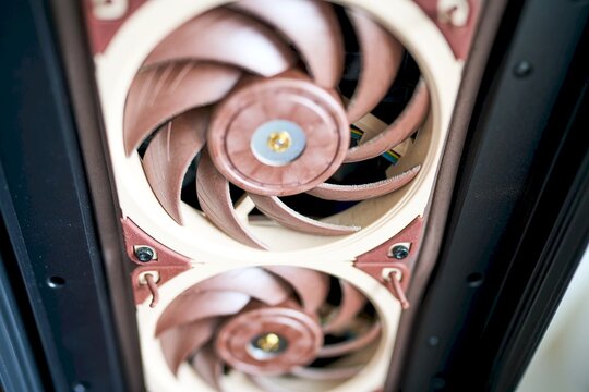 Dusty computer fans inside a gaming PC case