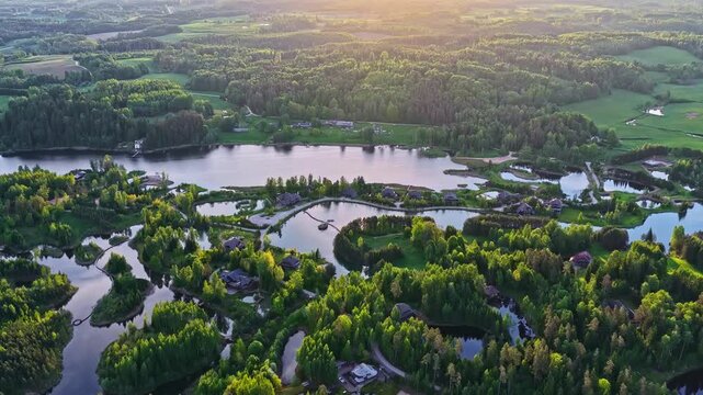 Luxury resort, islands, and woodland by Latvian lake at sunset