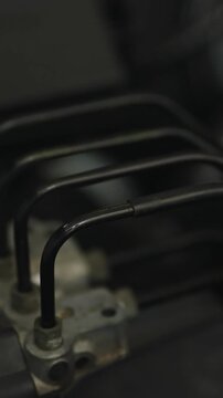  Anti-lock braking system (ABS) hydraulic unit with brake lines connected to it.