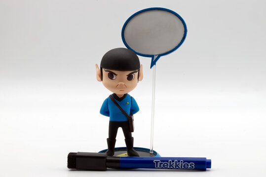 Bologna, Italy - June 11, 2026: Mr. Spock caricature figurine standing beside a blank speech bubble on a white studio background.