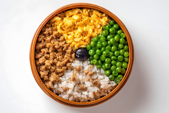 Delicious Soboro Bento with Ground Meat, Eggs, Green Peas, and Rice Arranged in a Full Plate View