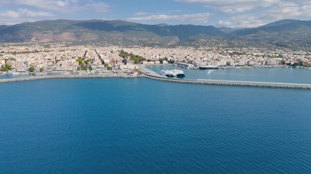 Aerial View of Kalamata Harbor and Waterfront, Coastal Cityscape with Marina, Port Infrastructure and Taygetus Mountains, Peloponnese Greece