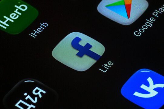 Iserlohn, Germany - June 04, 2026: Popular mobile apps like iHerb, Facebook and Google Play displayed on screen