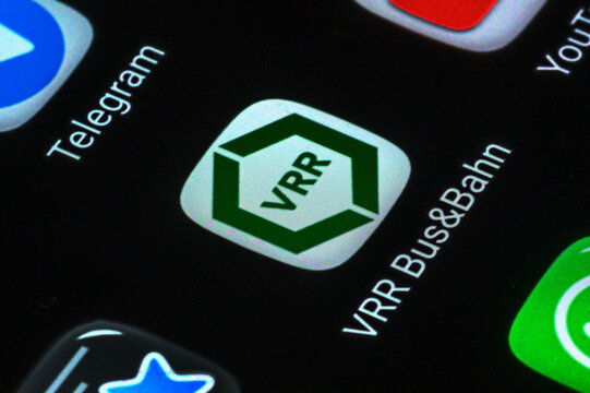 Iserlohn, Germany - June 04, 2026: Close-up of smartphone screen displaying VRR public transport and messaging apps