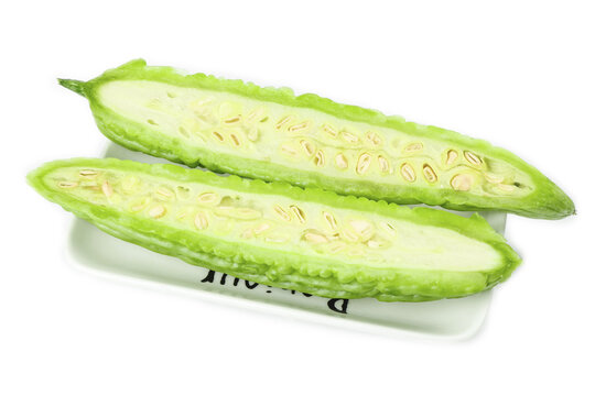 Fresh Bitter Melon Slices - Asian Vegetable Ingredient on White Background
