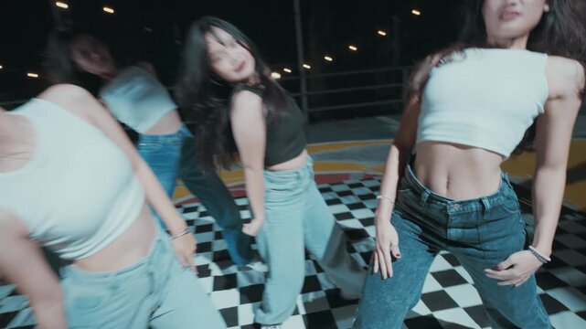 Girl Group Executing Complex Dance Choreography on Court