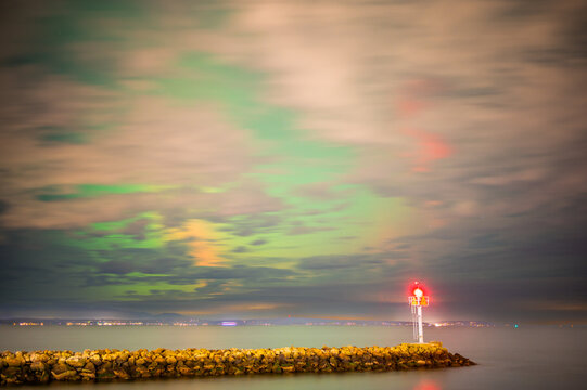 Northern Lights Behind Moving Clouds At Shilshole Marina