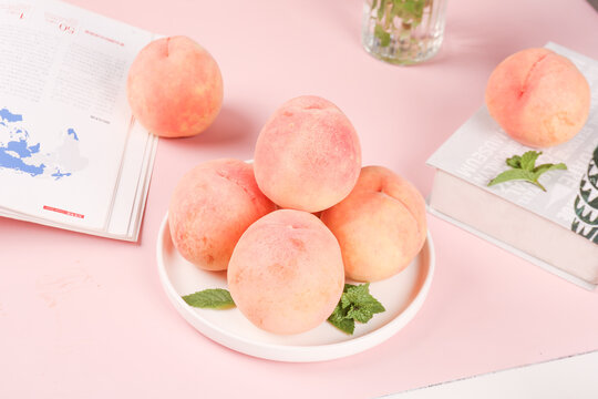 Fresh Large Yangshan Peaches on White Plate, Pink Background