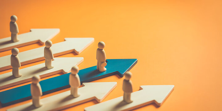 A group of people standing on arrows pointing in different directions on an orange background, symbolizing individuality and diverse paths in business or life