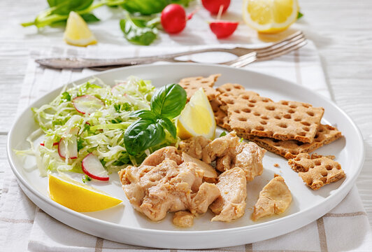 Cod liver with fresh salad, lemon, crispbreads