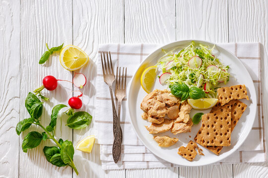 Cod liver with fresh salad, lemon, crispbreads