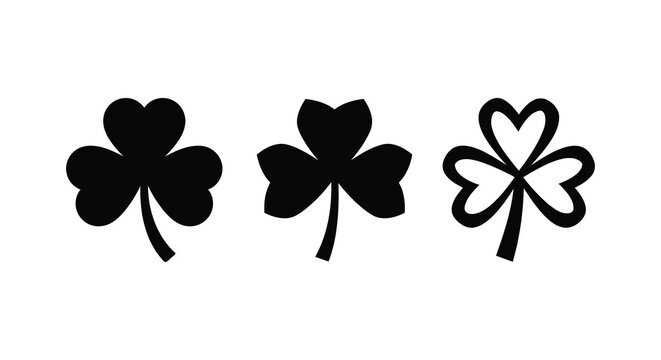 Three black clover silhouettes against a white background showcasing distinct leaf shapes silhouette cloverleaf