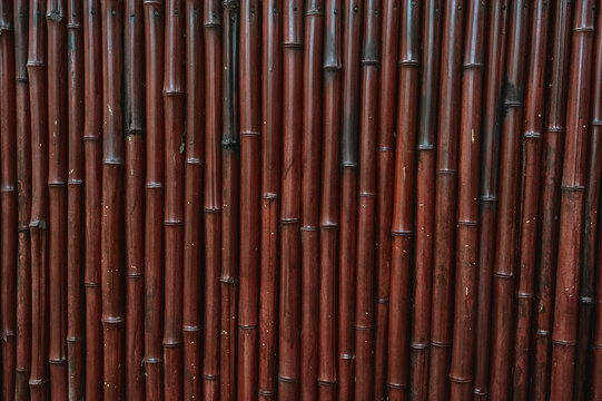 Bamboo texture forms a rustic natural background with brown tones