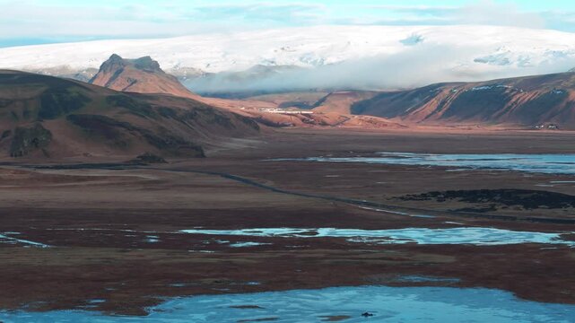 Vast M&yacute;rdalsj&ouml;kull glacier landscape with mountains and distant road