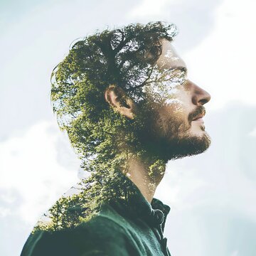 Double exposure portrait of a man with trees and sky overlay.