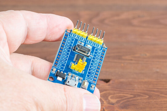 Development board STM and programmer in hand