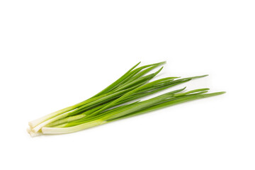 Fototapeta premium Green onions isolated on white background. Sliced ​​green onions in a bowl on the table. Fresh herbs on a cutting board. Organic natural greens. Vegan. Space for text. Copy space.