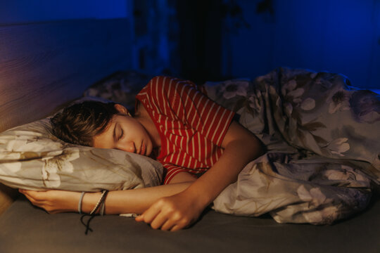 Serene teenage girl enjoying deep sleep for mental health wellness concept