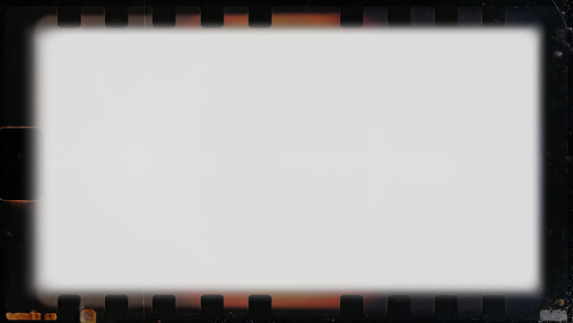 Dark grunge vintage film frame overlay with soft glowing center on transparent background. Perfect damaged analog border for creative photo masks, slideshows and nostalgic videos.