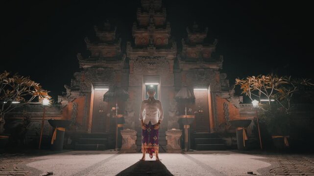 Full Body Shot of Balinese Man at Temple Gate