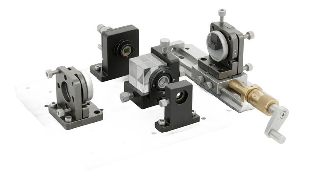 Optical bench setup with mounted lenses, prisms and manual adjustment knobs on an aluminum breadboard plate isolated on white background