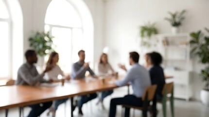Fototapeta premium Diverse business team brainstorming during meeting in bright modern office space with blurred focus for professional corporate atmosphere and collaborative work environment concept