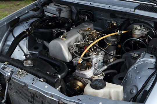 Vintage mercedes - benz 280 CE car with engine exposed.