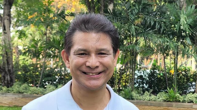 Happy and Healthy Southeast Asian senior man, smiling in happy positive glad mood expression, real asian people model, focus shift in shot