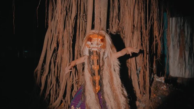 Rangda Witch Dancing with Claws in Forest