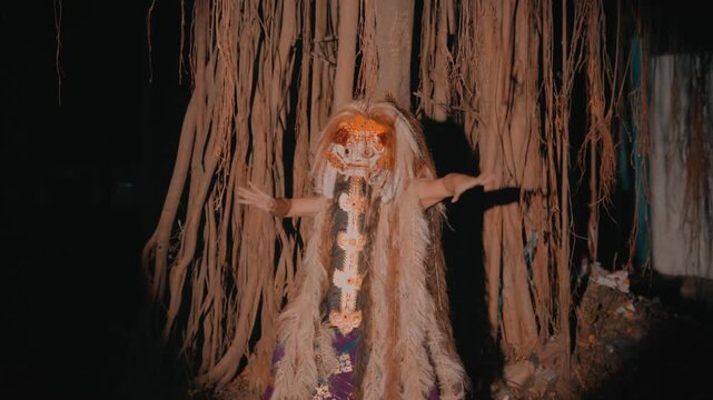 Mystical Rangda Figure Performing Hand Gestures