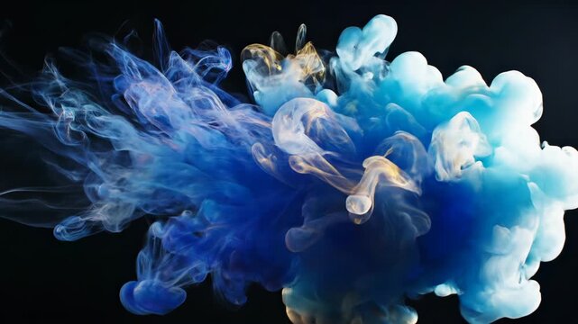 Abstract blue ink cloud expanding in water against a solid black background. Detailed swirling liquid textures and organic flowing shapes in vibrant cobalt tones.