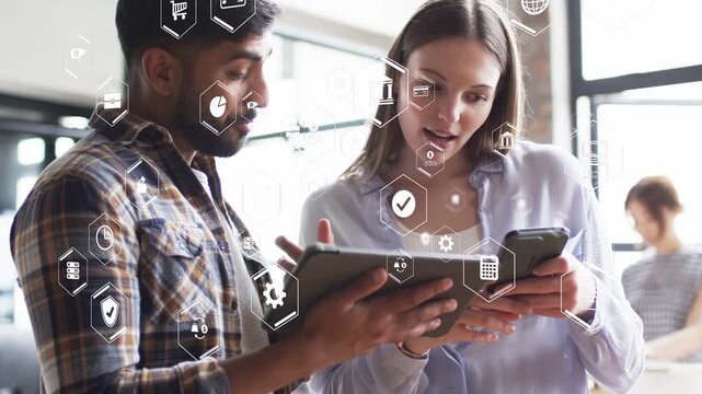 Man tapping tablet and woman pointing, initiating hex UI overlay and cross-checking finance chart