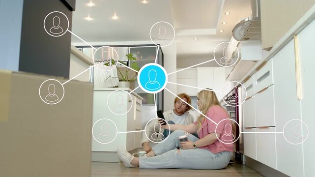 Man turning device toward partner, network nodes converging to blue node between heads showing tech
