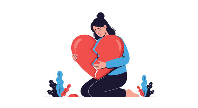 Sad crying young woman kneeling on the floor and trying to hold together a giant broken red heart representing heartbreak.