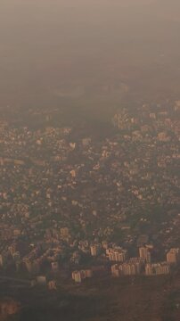 Ulhas river, Mumbai, India. Badlapur is a city in Thane district, Maharashtra state, India, and is a part of Mumbai Metropolitan Region. Aerial View From Airplane Window On View of the Mumbai suburb