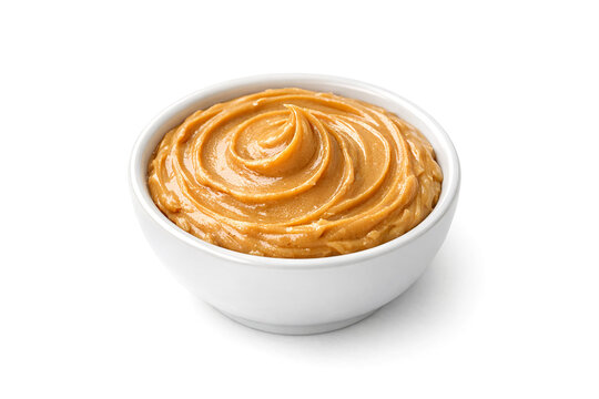 A delicious hummus served in a white bowl with a spoonful scooped out.