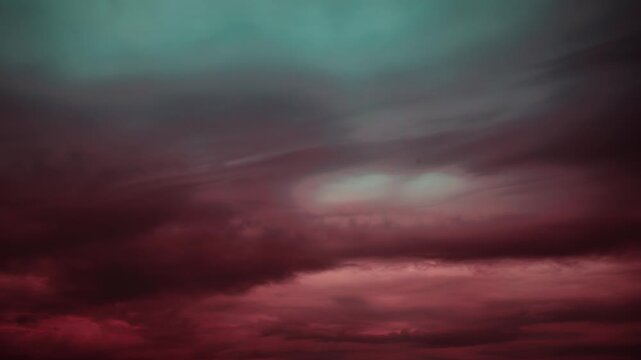 timelapse, time lapse Dramatic red and green muted storm clouds creating a moody sky, timelapse