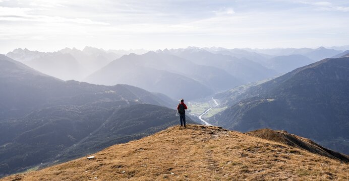 Mountaineers in front of a mountain panorama on the Venet, view of the Upper Inn Valley in the morning light, Venet crossing, &Ouml;tztal Alps, Tyrol, Austria